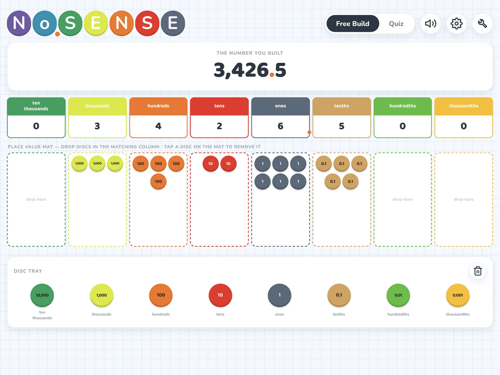 Build-a-Number with discs placed on the place-value mat to make 3,426.5